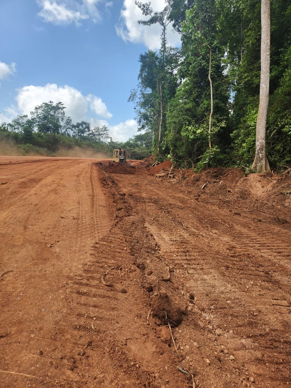 Bediako Junction to Sefwi Adabokrom road construction site with equipment in the Western North Region by Kingspok Construction Works Limited